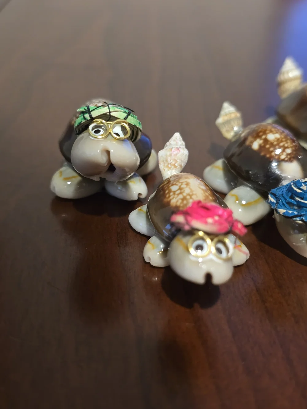 Four Cute Handmade Mini Turtles Made From Seashells with Glasses and Straw Hats